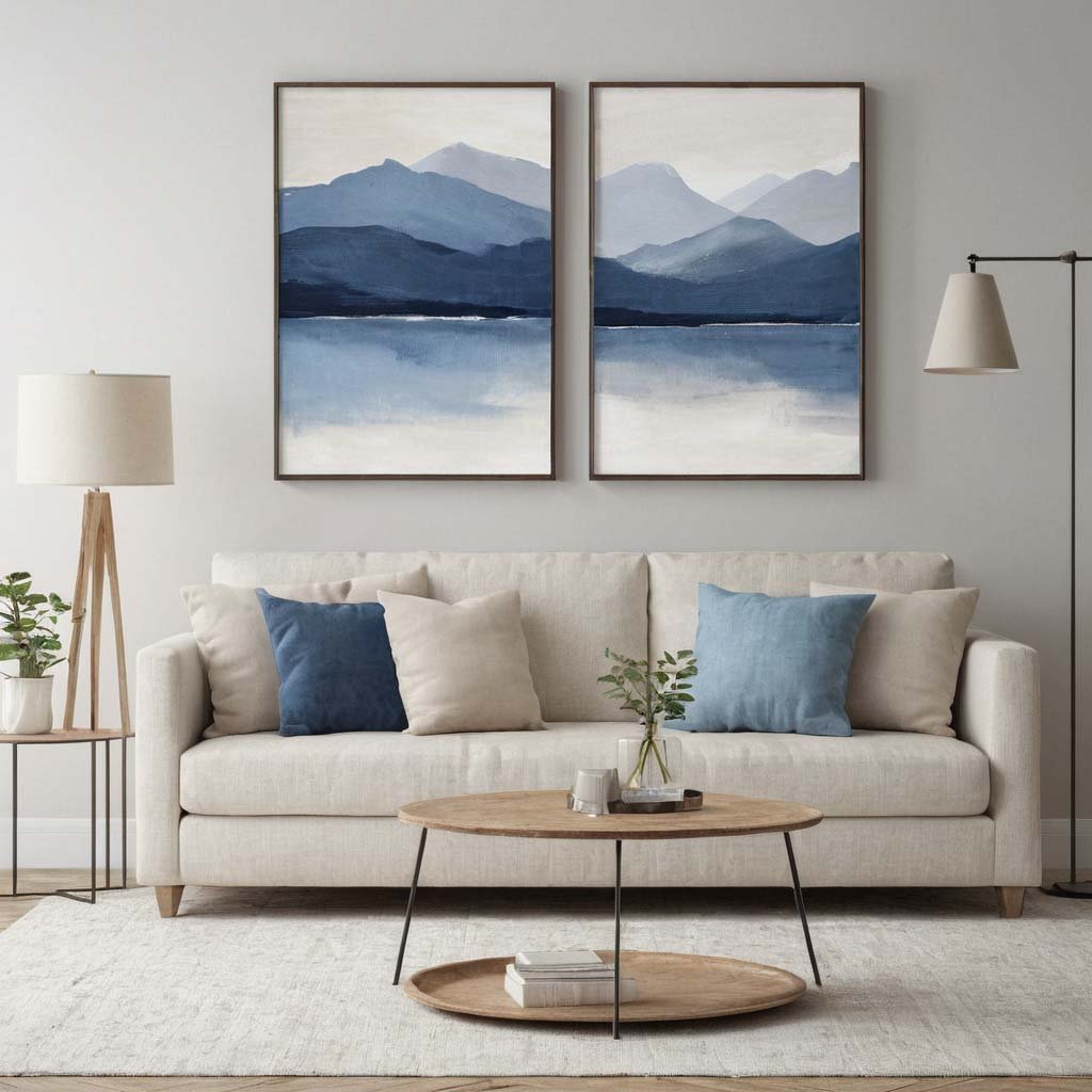 Minimalist Wall Art: A series of two minimalistic landscape paintings, evenly distributed on the wall of a studio apartment to add interest and grace without overloading the space, neutral calm gray and blue color